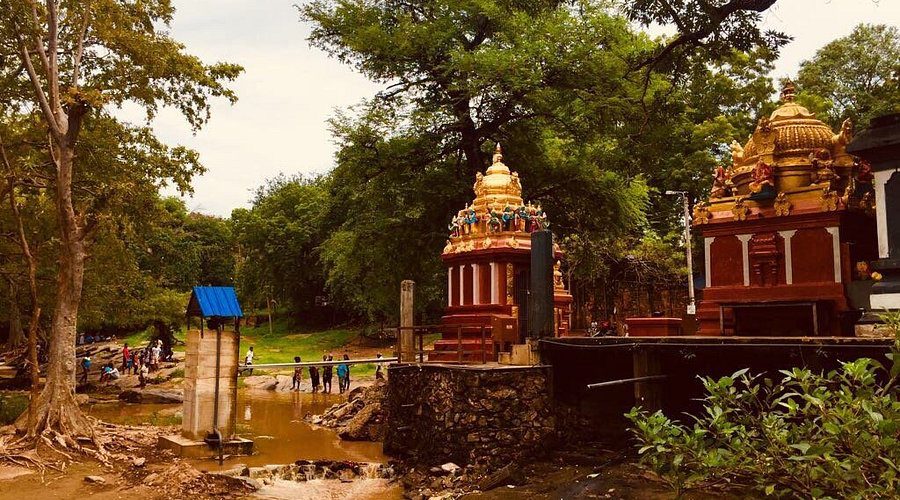 Golden shrines beside the Menik Ganga at Kataragama
