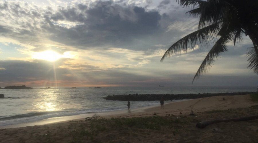 Sunset over the shallow water at Casuarina Beach