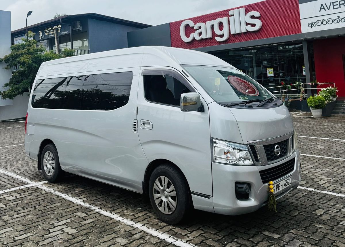 The Maria Travels van — a silver high-roof Nissan NV350
